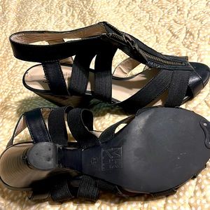 Black MRKT gladiator style mid-low heel sandals.